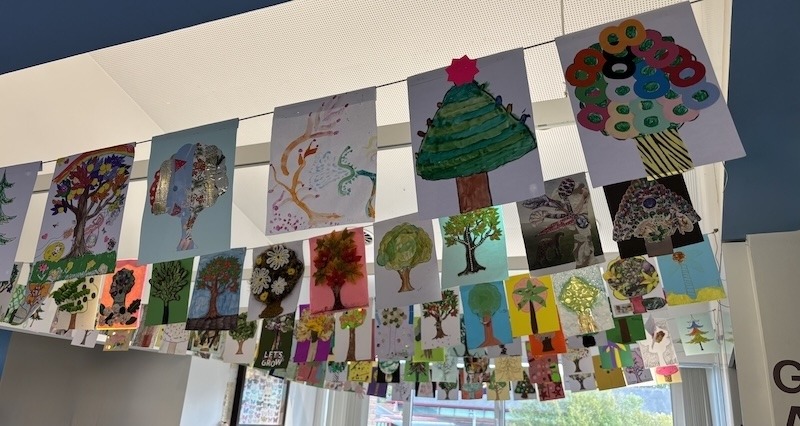 Community tree art hanging from ceiling